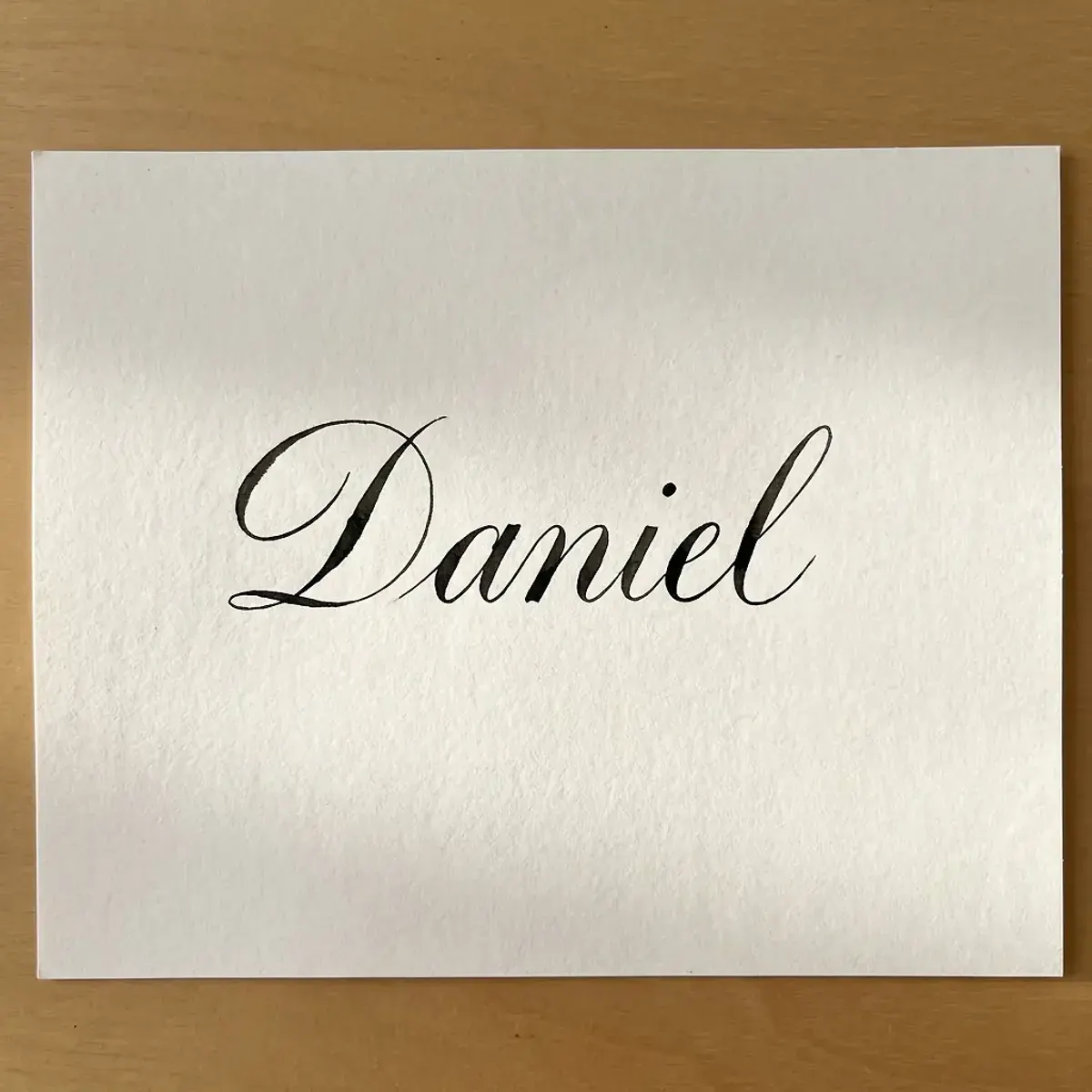 The name Daniel in elegant calligraphy