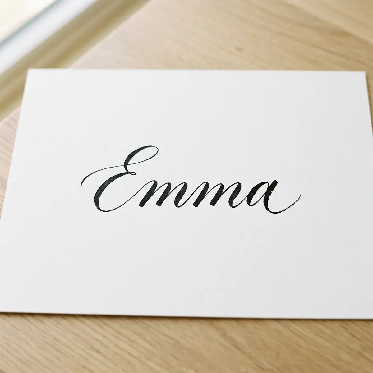 The name Emma in elegant calligraphy