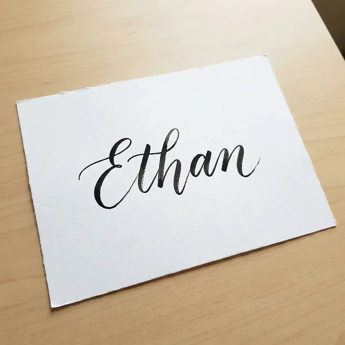 The name Ethan in elegant calligraphy